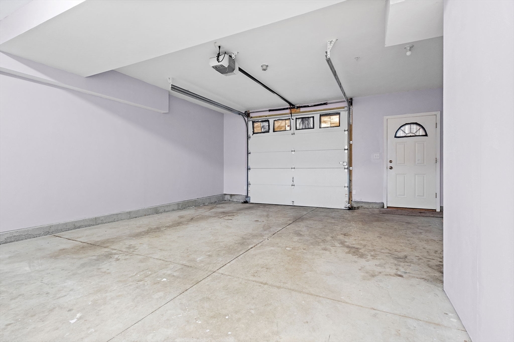 7 Butler Avenue, Unit 5 Lowell, MA 01852 - Photo 22 of 28 a view of a garage