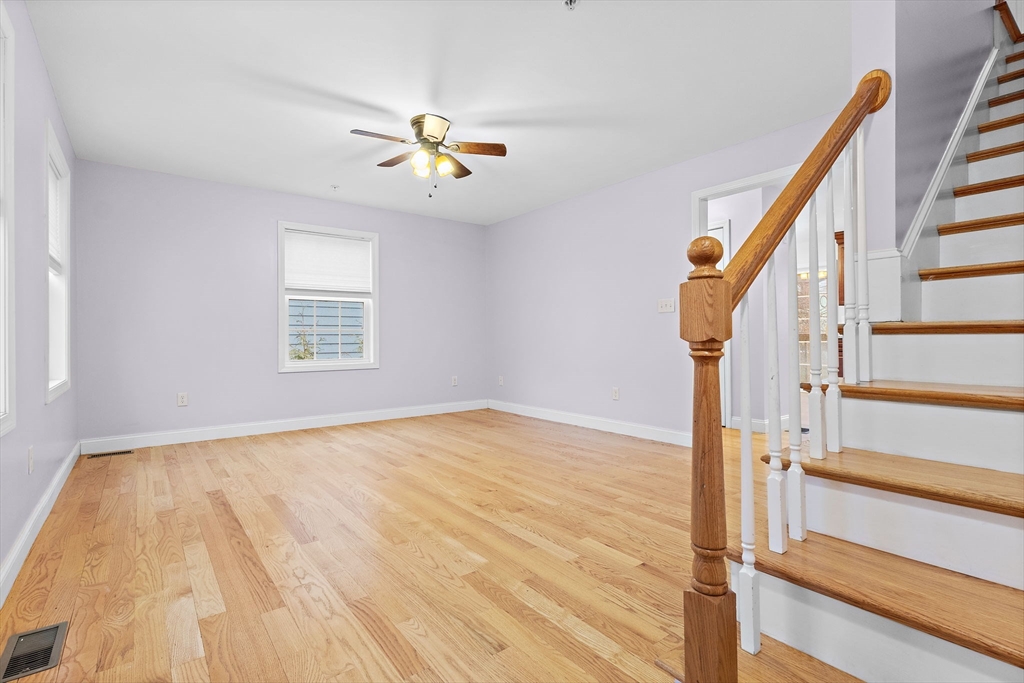 7 Butler Avenue, Unit 5 Lowell, MA 01852 - Photo 6 of 28 a view of empty room with wooden floor and fan