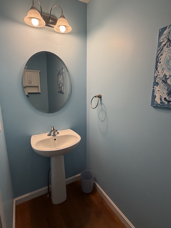 353 Fuller Street, Unit 6 Ludlow, MA 01056 - Photo 12 of 30 a bathroom with a sink and a mirror