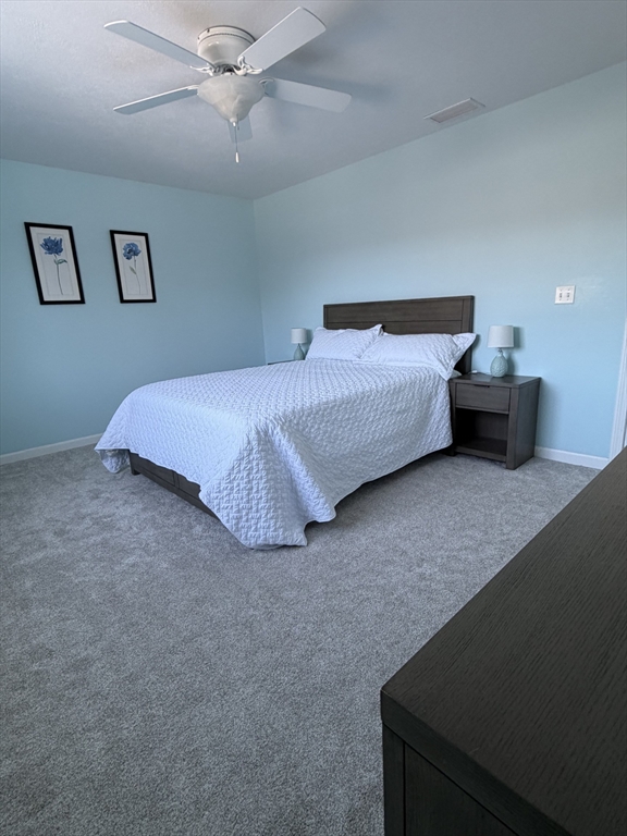 353 Fuller Street, Unit 6 Ludlow, MA 01056 - Photo 17 of 30 a bedroom with a bed and a ceiling fan