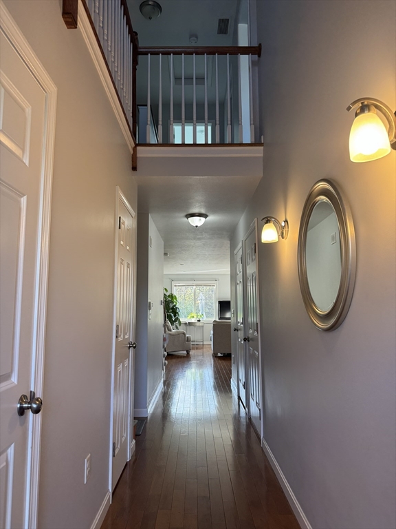 353 Fuller Street, Unit 6 Ludlow, MA 01056 - Photo 5 of 30 a view of hallway with wooden floor