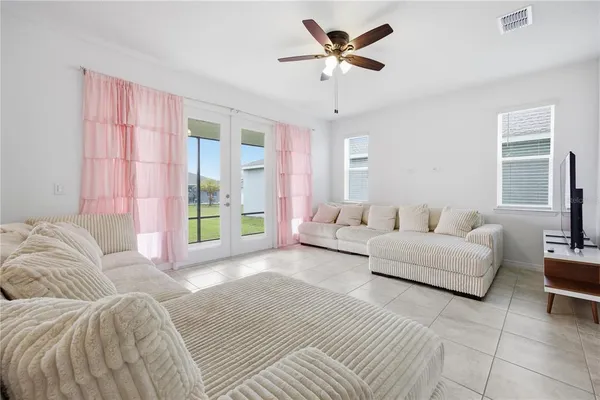 a living room with furniture and a large window