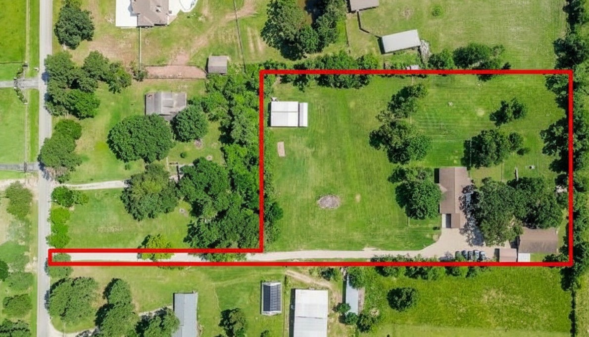 22035 Buescher Road Tomball, TX 77377 - Photo 6 of 43 a view of a bunch of flowers and trees