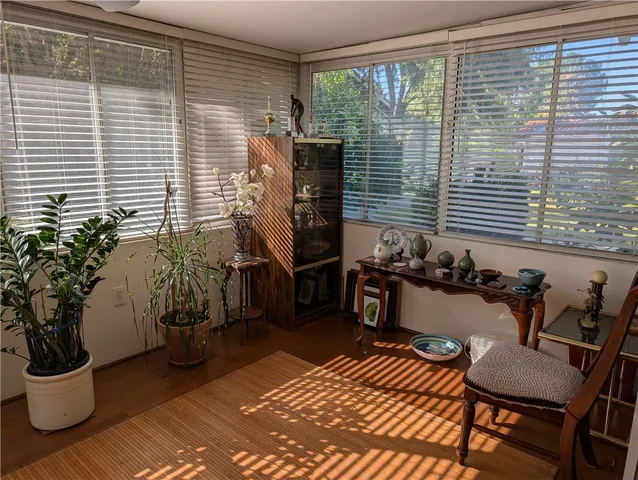 a view of a room with a door and wooden floor