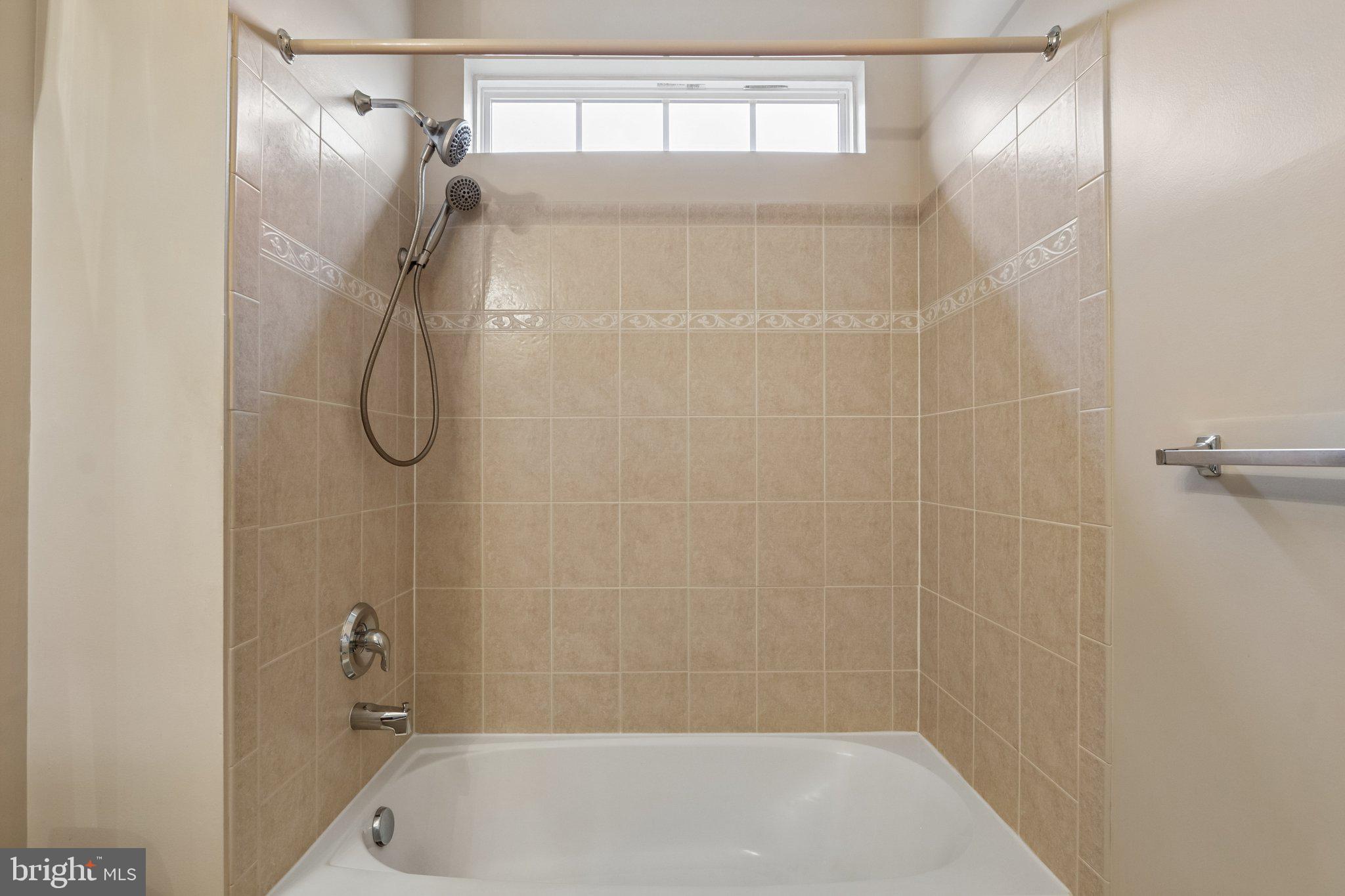 39 Danbury Road Swedesboro, NJ 08085 - Photo 18 of 62 a bathroom with a bath tub with a shower