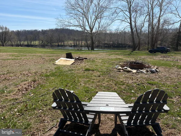 a view of a lake with houses in the back