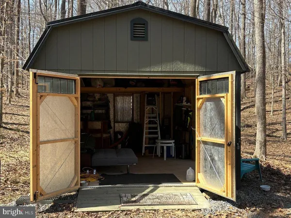 a view of a chairs and table in a patio