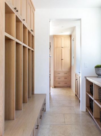 a kitchen with granite countertop a sink and a refrigerator