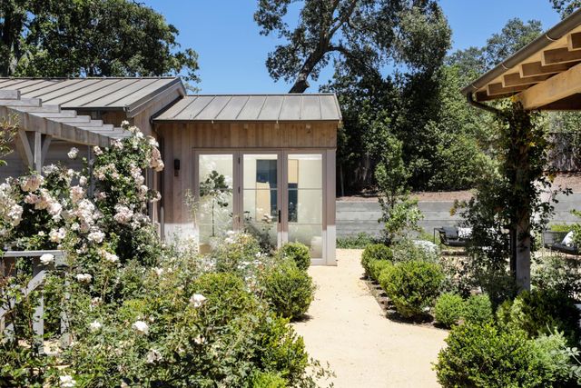 a room with gym equipment and a flat screen tv