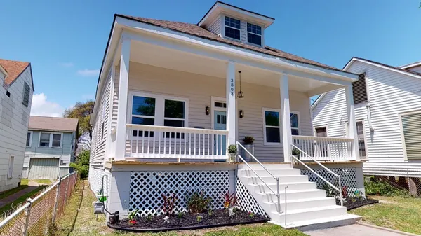 front view of a house with a large window