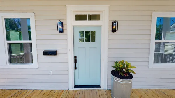 a house with beautiful flower in front of house