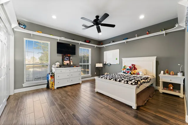 a bedroom with furniture and window