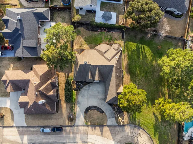 an aerial view of a house with a lake view