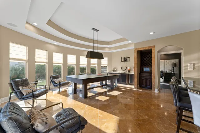 a living room with furniture a window and a table