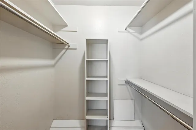 a view of an empty walk in closet