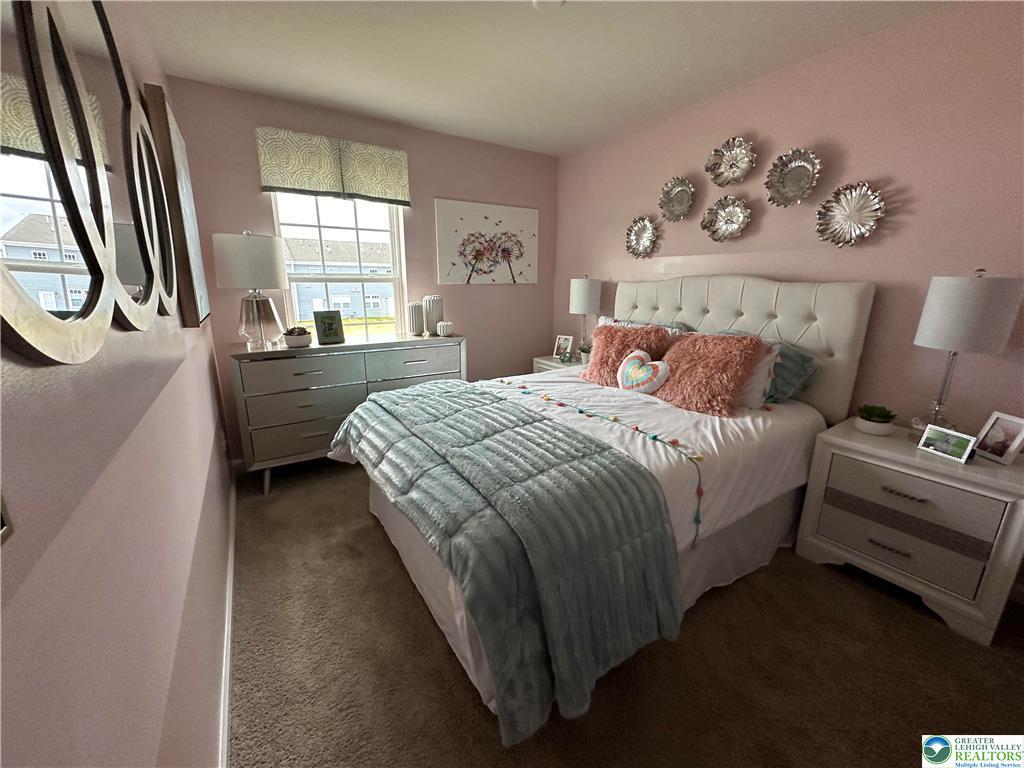 1145 Martin Road Breinigsville, PA 18031 - Photo 20 of 38 A comforting bedroom space features ample natural light from a well-placed window.