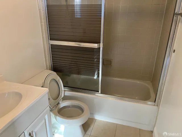a bathroom with a sink a toilet and bathtub
