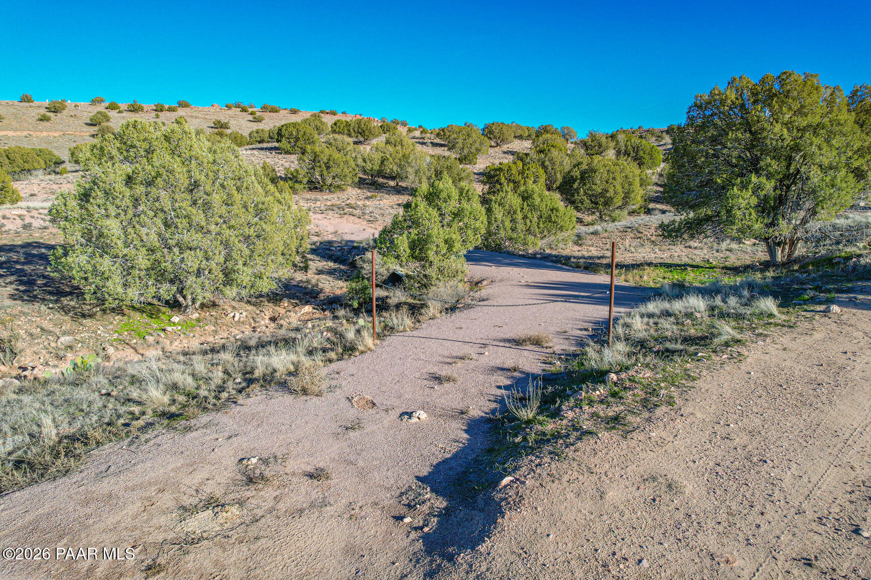 0 East Crow Hop Trail Paulden, AZ 86334 - Photo 3 of 21 a view of a road with a yard