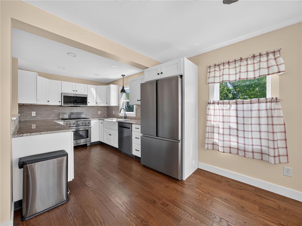 291 East Dannersville Road Bath, PA 18014 - Photo 29 of 46 A well-appointed culinary space featuring sleek stainless steel appliances and rich hardwood floors.