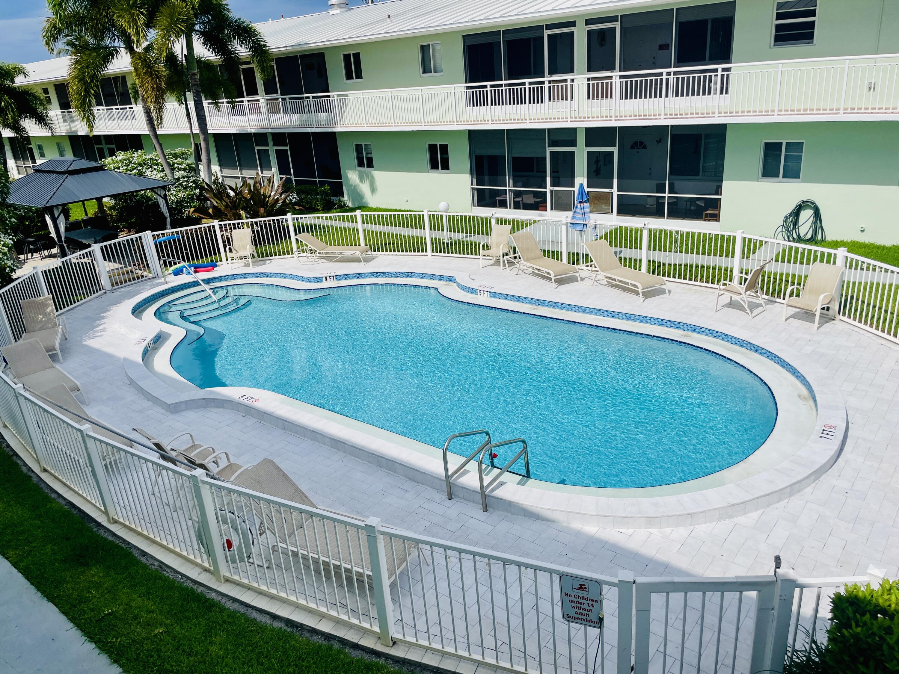 2100 Northeast 38th Street, Unit 142 Lighthouse Point, FL 33064 - Photo 36 of 42 Pool Area (4)