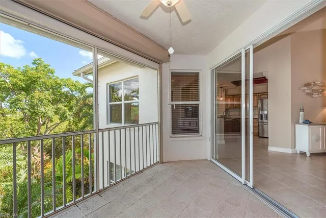 a view of porch with a floor to ceiling window and wooden floor