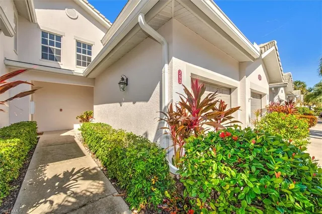 a view of a house with a flower garden