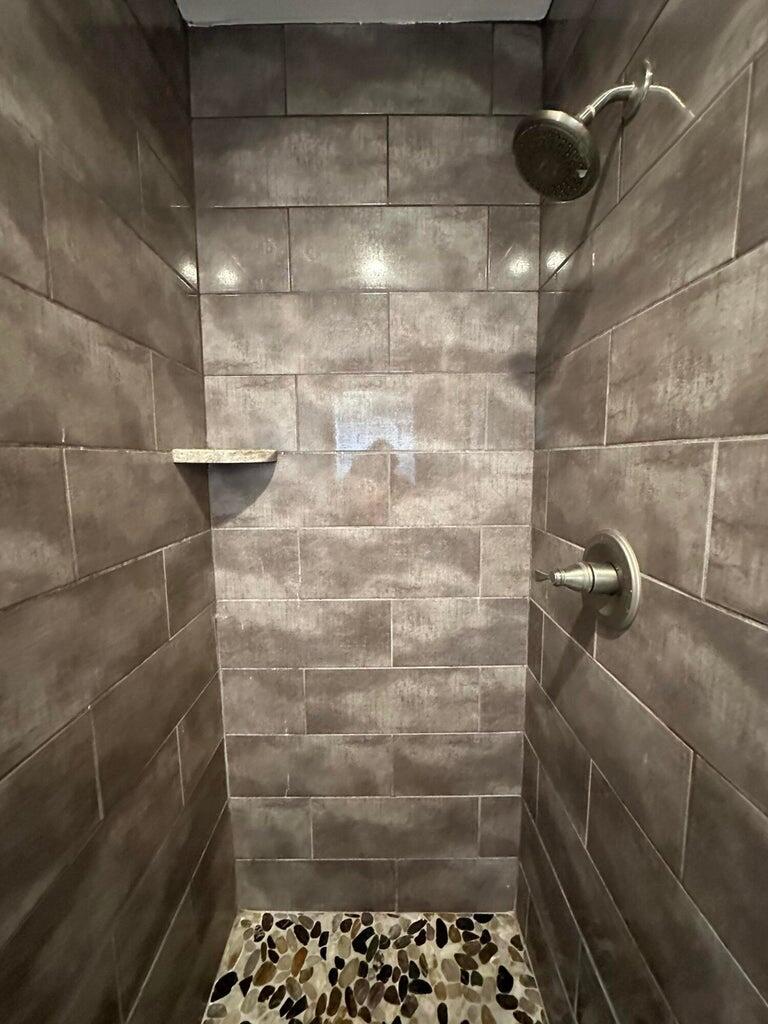 300 Northeast 42nd Street Boca Raton, FL 33431 - Photo 11 of 53 a bathroom with a shower