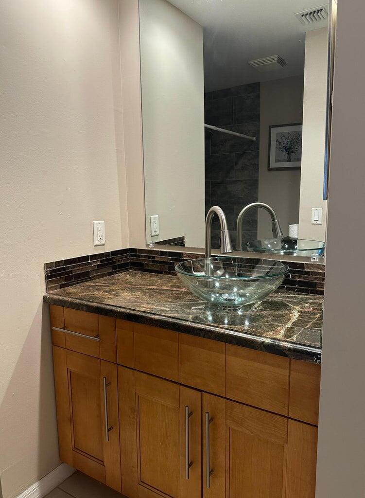 300 Northeast 42nd Street Boca Raton, FL 33431 - Photo 17 of 53 a close view of sink and tap