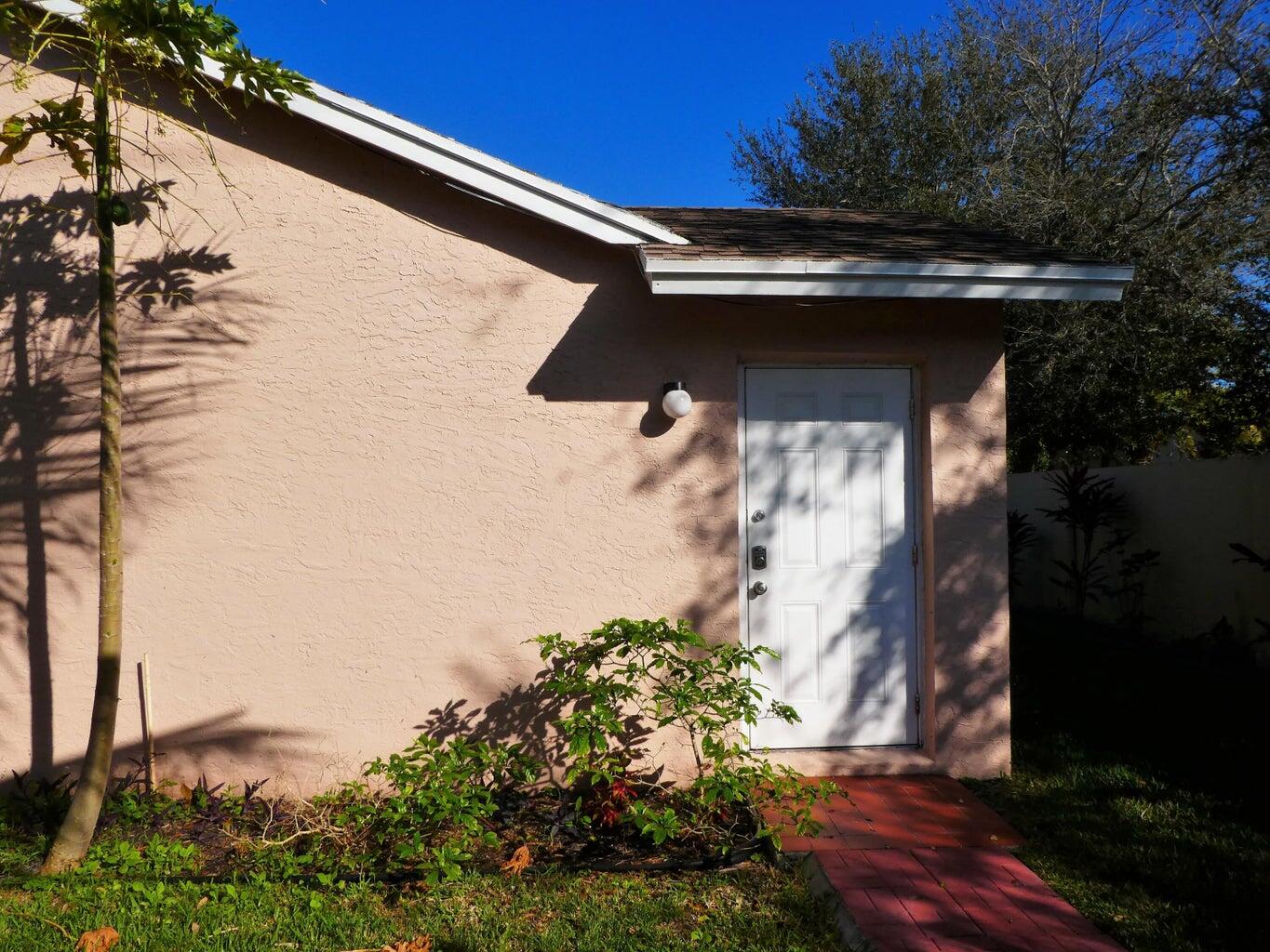300 Northeast 42nd Street Boca Raton, FL 33431 - Photo 25 of 53 a view of backyard with plants