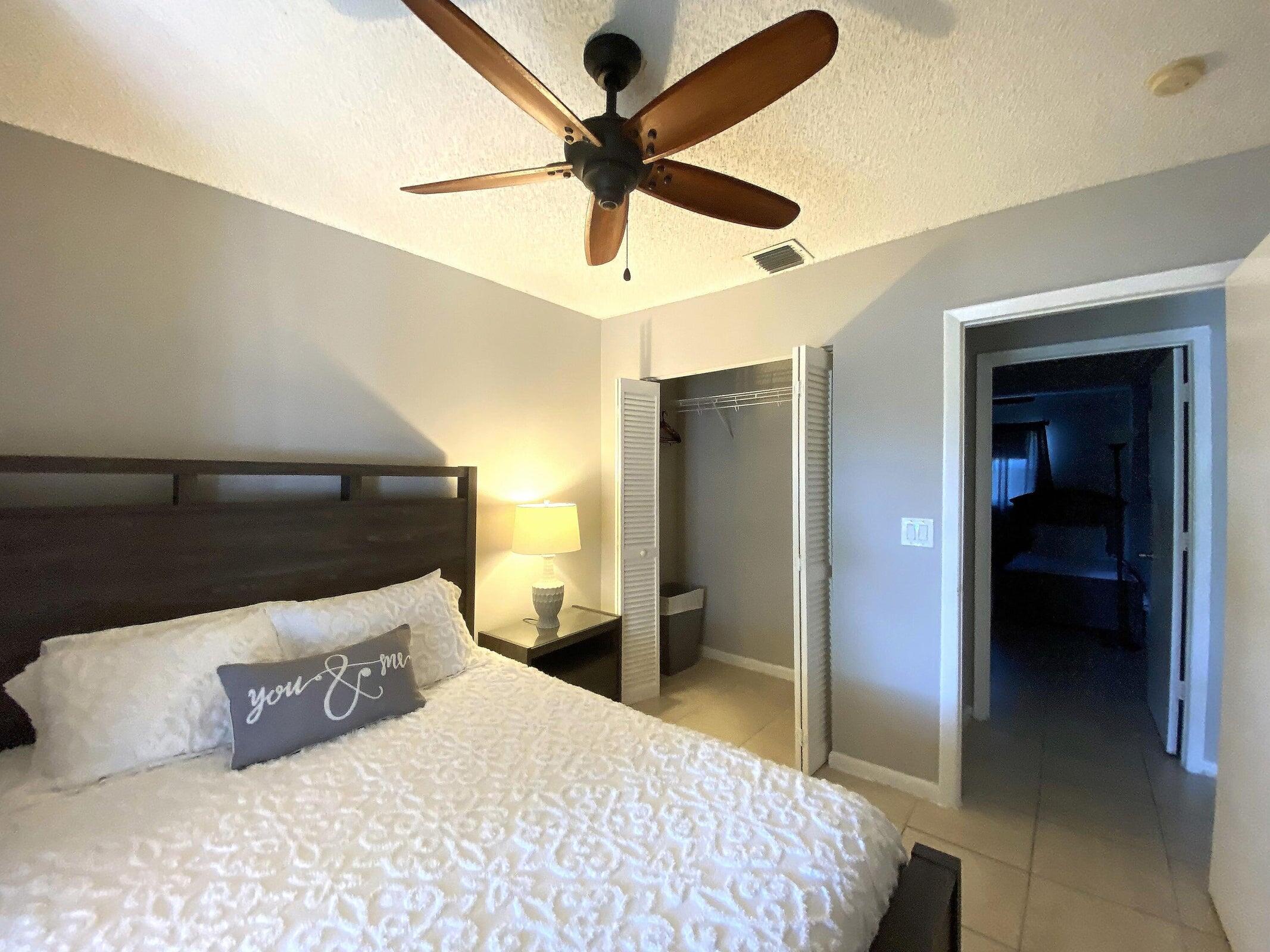 300 Northeast 42nd Street Boca Raton, FL 33431 - Photo 33 of 53 a bedroom with a bed and a walk in closet