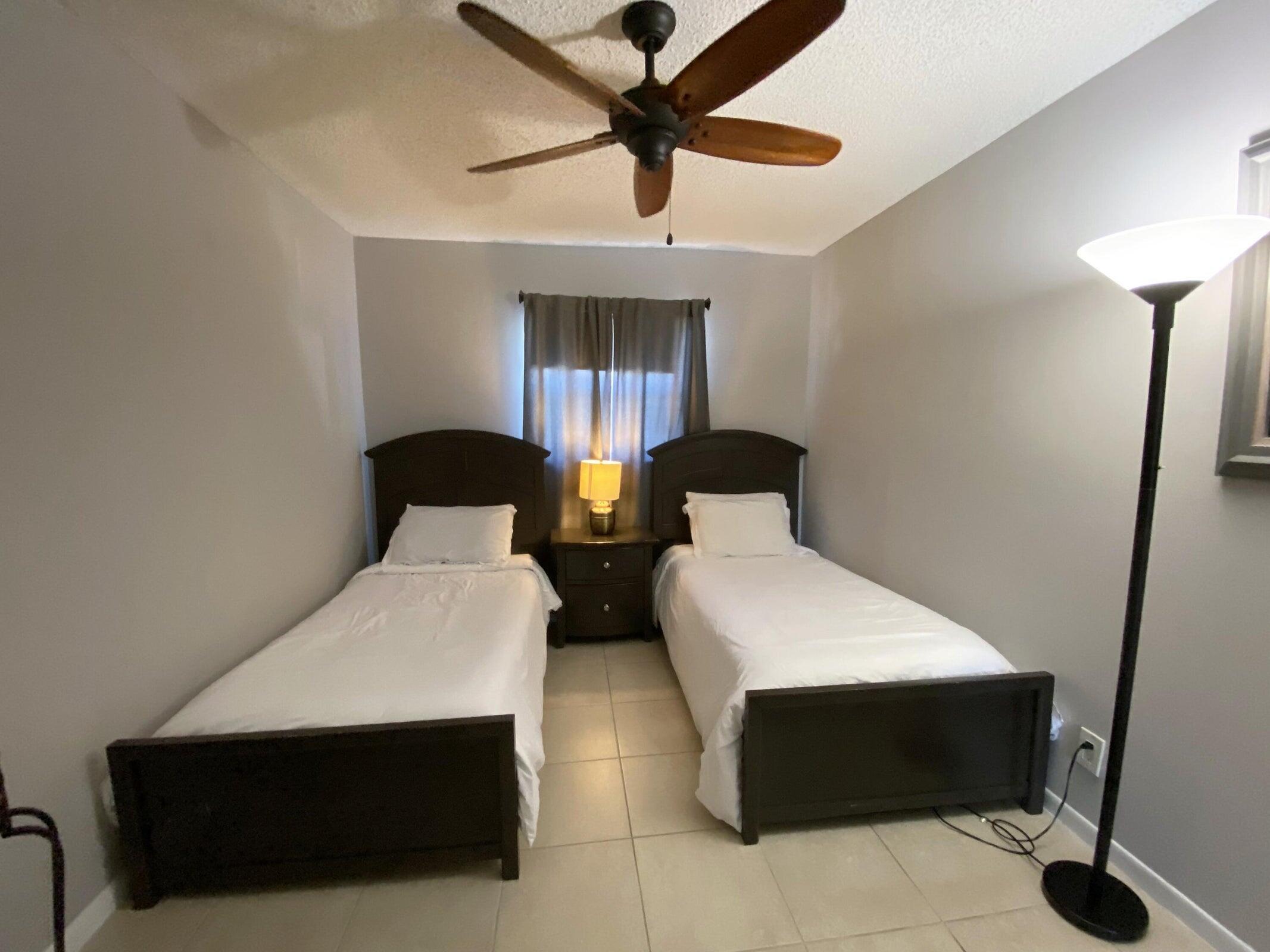 300 Northeast 42nd Street Boca Raton, FL 33431 - Photo 36 of 53 a living room with furniture and a ceiling fan