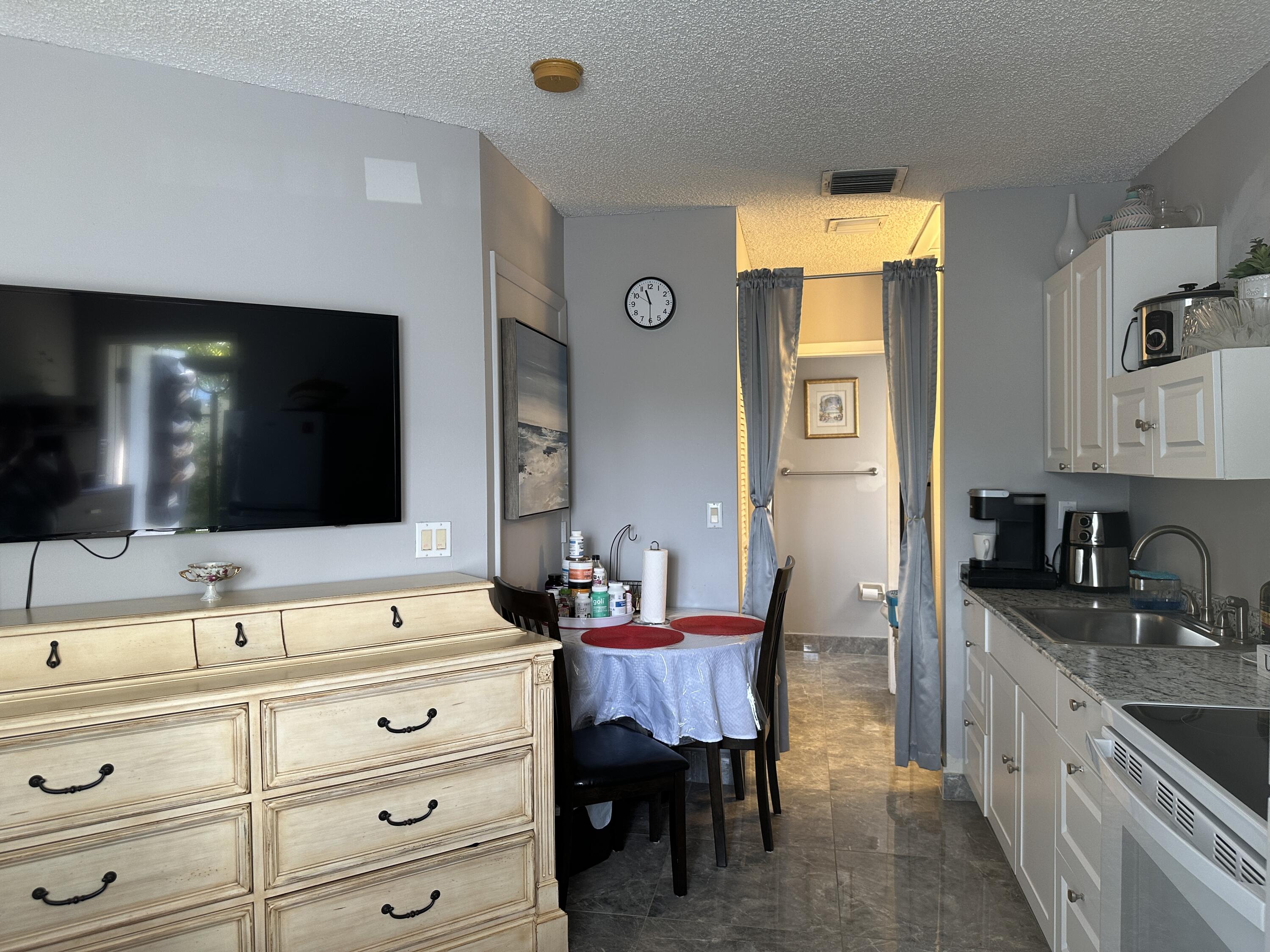 300 Northeast 42nd Street Boca Raton, FL 33431 - Photo 42 of 53 a spacious bathroom with a sink double vanity granite and a mirror