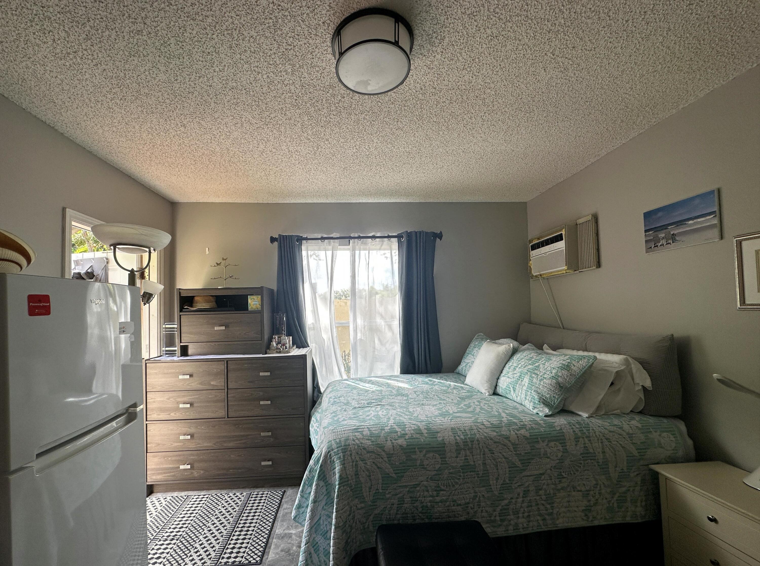 300 Northeast 42nd Street Boca Raton, FL 33431 - Photo 49 of 53 a bed room with a bed and a closet