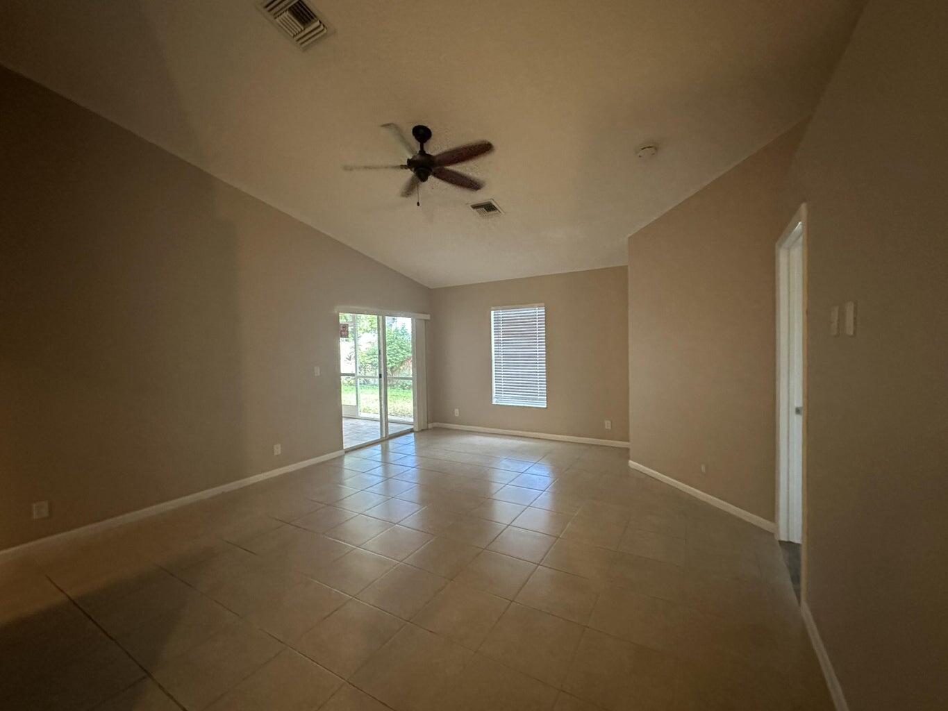 300 Northeast 42nd Street Boca Raton, FL 33431 - Photo 5 of 53 a view of empty room with wooden floor and fan