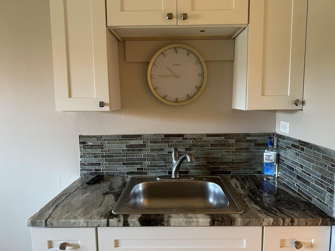 300 Northeast 42nd Street Boca Raton, FL 33431 - Photo 8 of 53 a bathroom with a granite countertop and sink