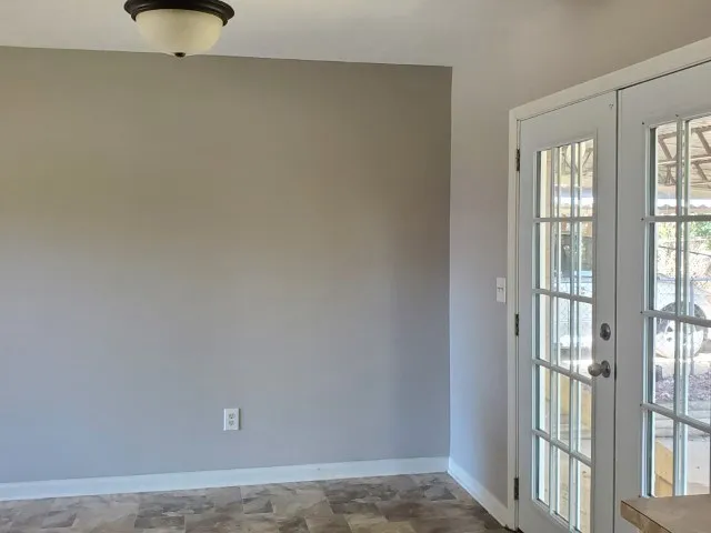 a view of an empty room and window