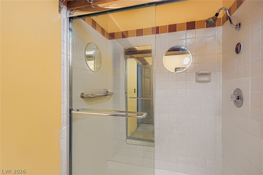 4723 Desert Vista Road Las Vegas, NV 89121 - Photo 18 of 29 Full bathroom featuring tiled shower