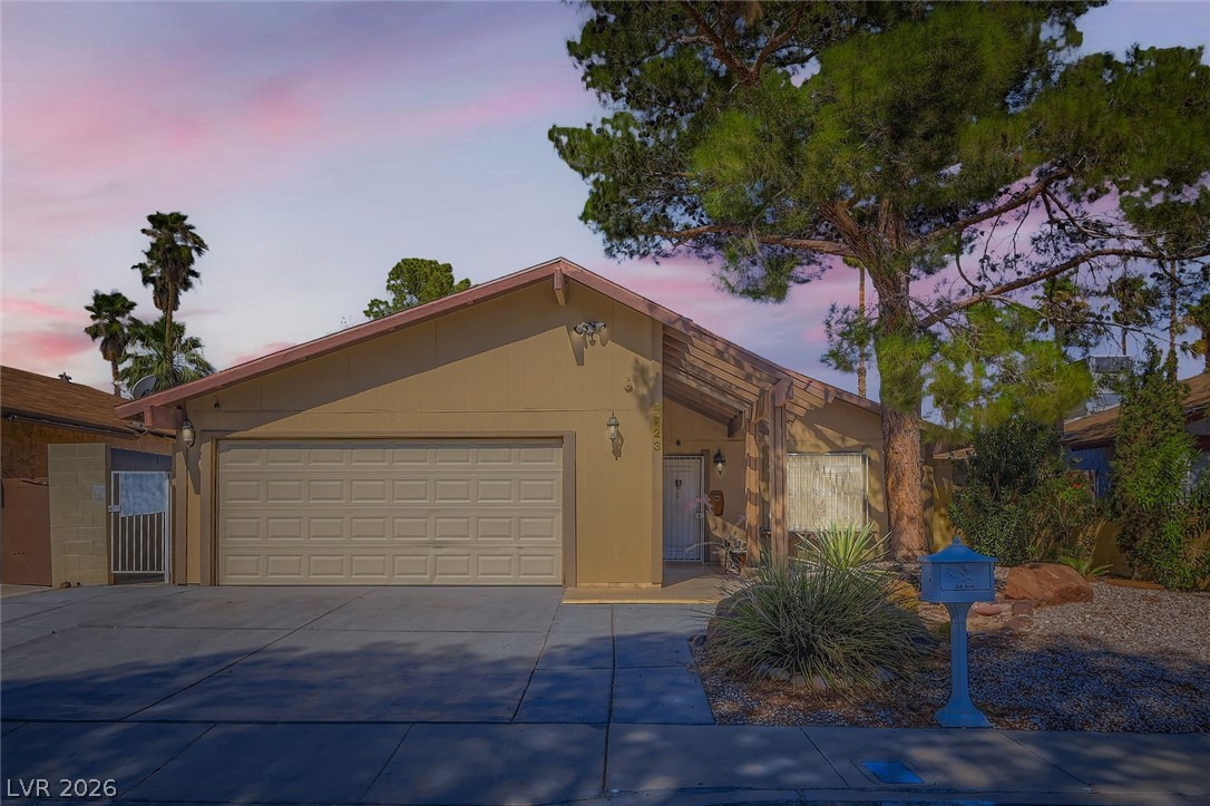 4723 Desert Vista Road Las Vegas, NV 89121 - Photo 2 of 29 View of front of property featuring driveway and a garage