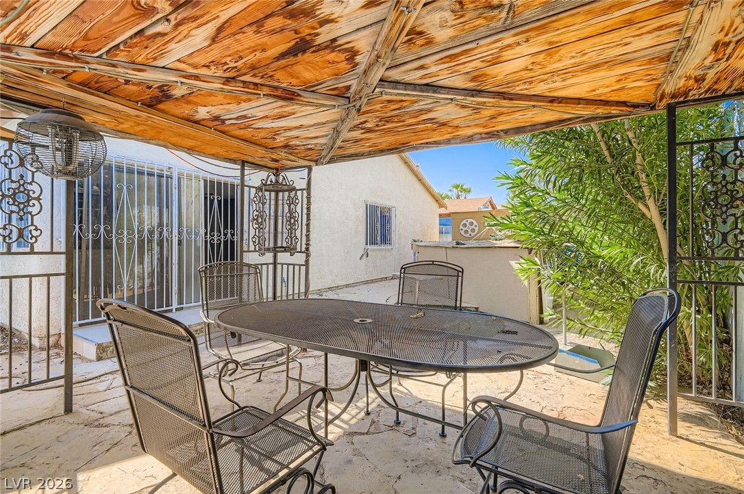 4723 Desert Vista Road Las Vegas, NV 89121 - Photo 27 of 29 View of patio / terrace featuring outdoor dining area