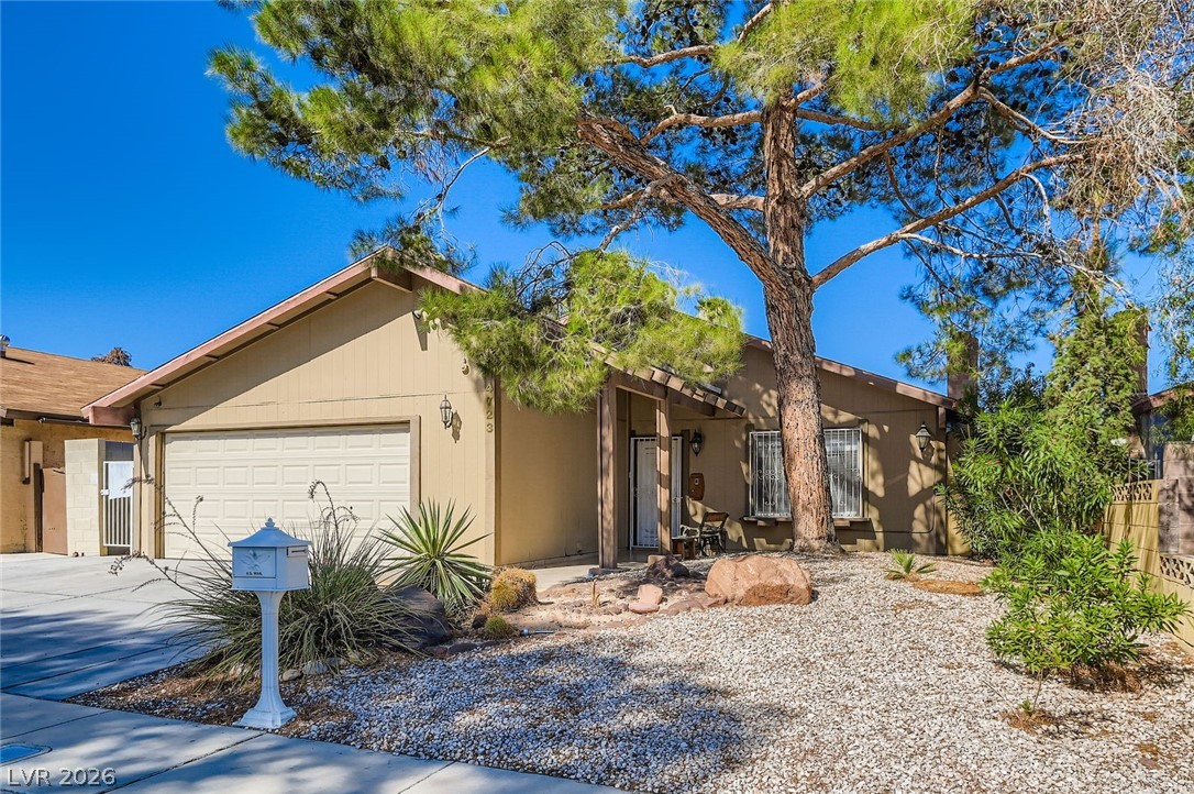 4723 Desert Vista Road Las Vegas, NV 89121 - Photo 3 of 29 Single story home with a garage and driveway