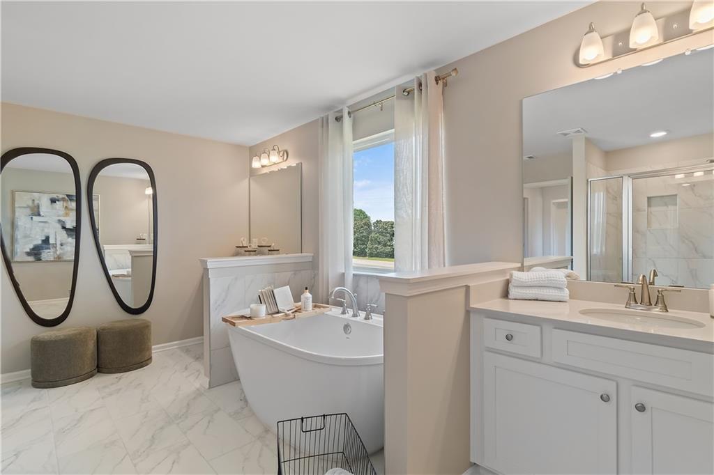 157 Haverling Pass Atlanta, GA 30349 - Photo 45 of 45 a bathroom with a sink mirror and a window