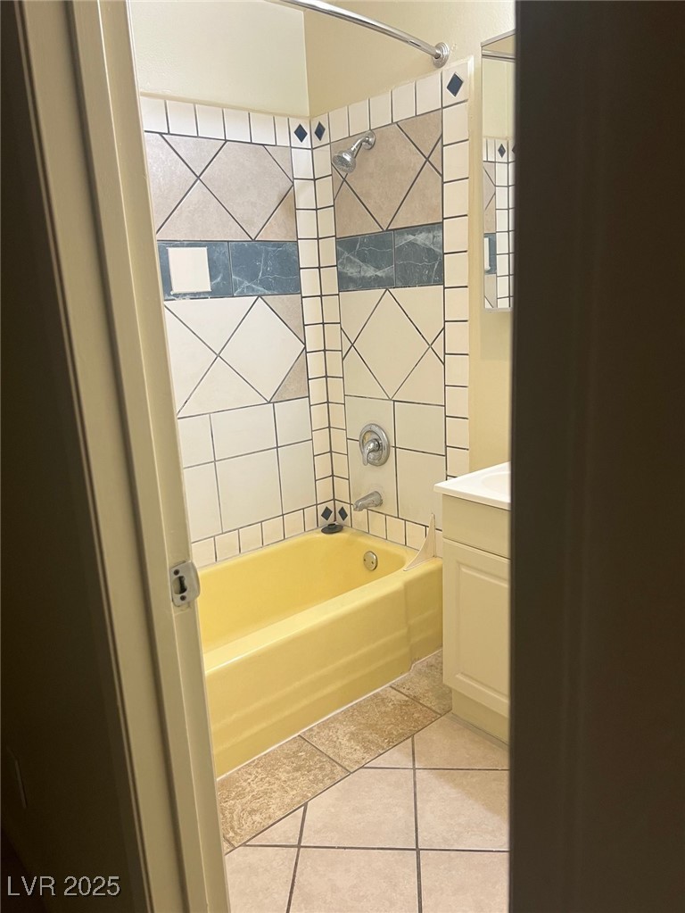 1388 East Desert Inn Road, Unit 1 Las Vegas, NV 89169 - Photo 9 of 17 Full bathroom with tile patterned floors, shower / washtub combination, and vanity