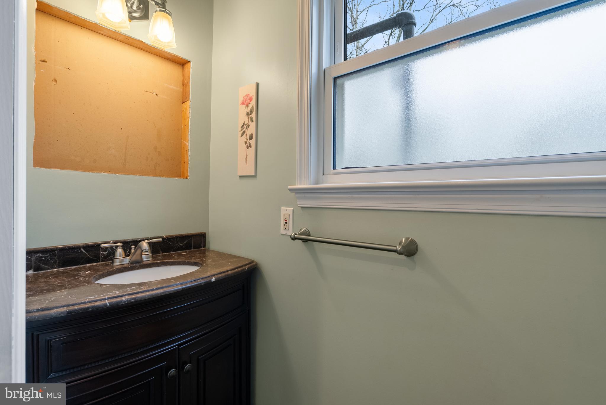 33 Derstine Road Hatfield, PA 19440 - Photo 14 of 32 a bathroom with a sink and a mirror
