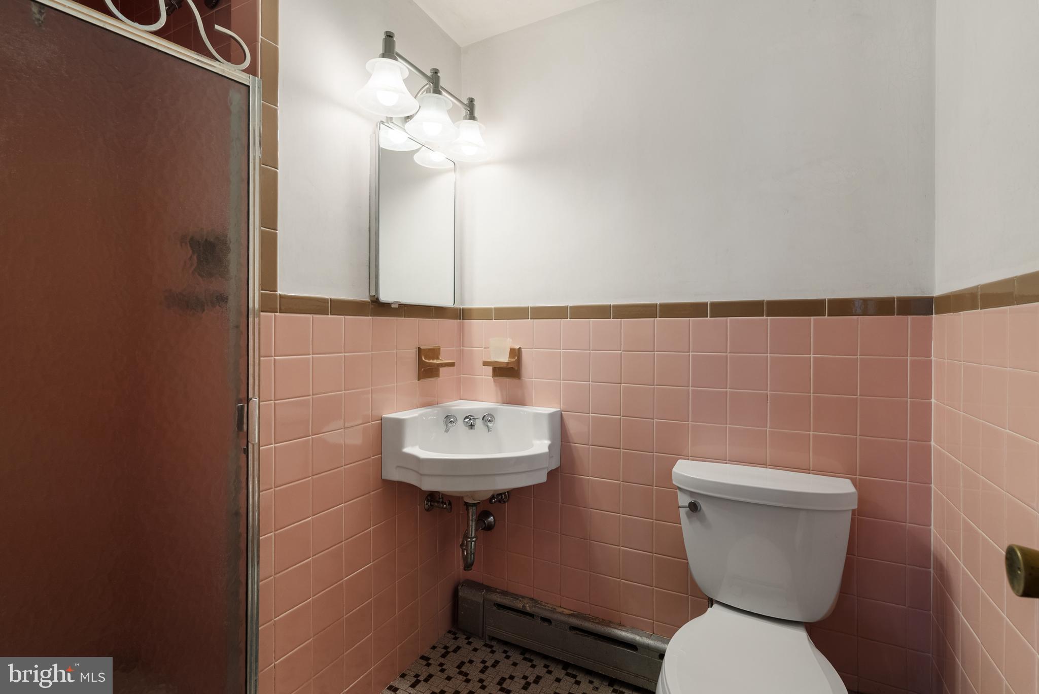 33 Derstine Road Hatfield, PA 19440 - Photo 18 of 32 a bathroom with a sink a toilet and a mirror