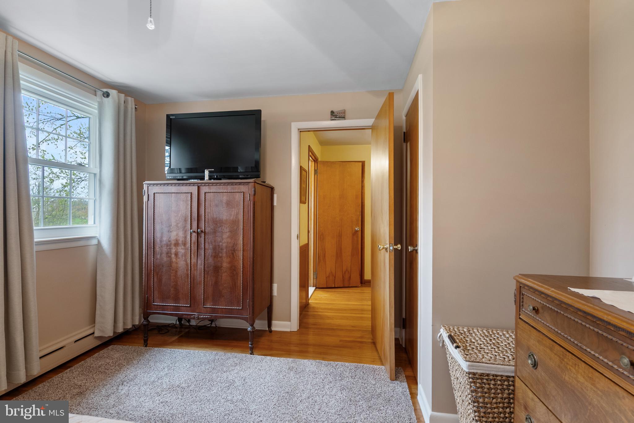 33 Derstine Road Hatfield, PA 19440 - Photo 21 of 32 a view of a livingroom with wooden floor and a flat screen tv