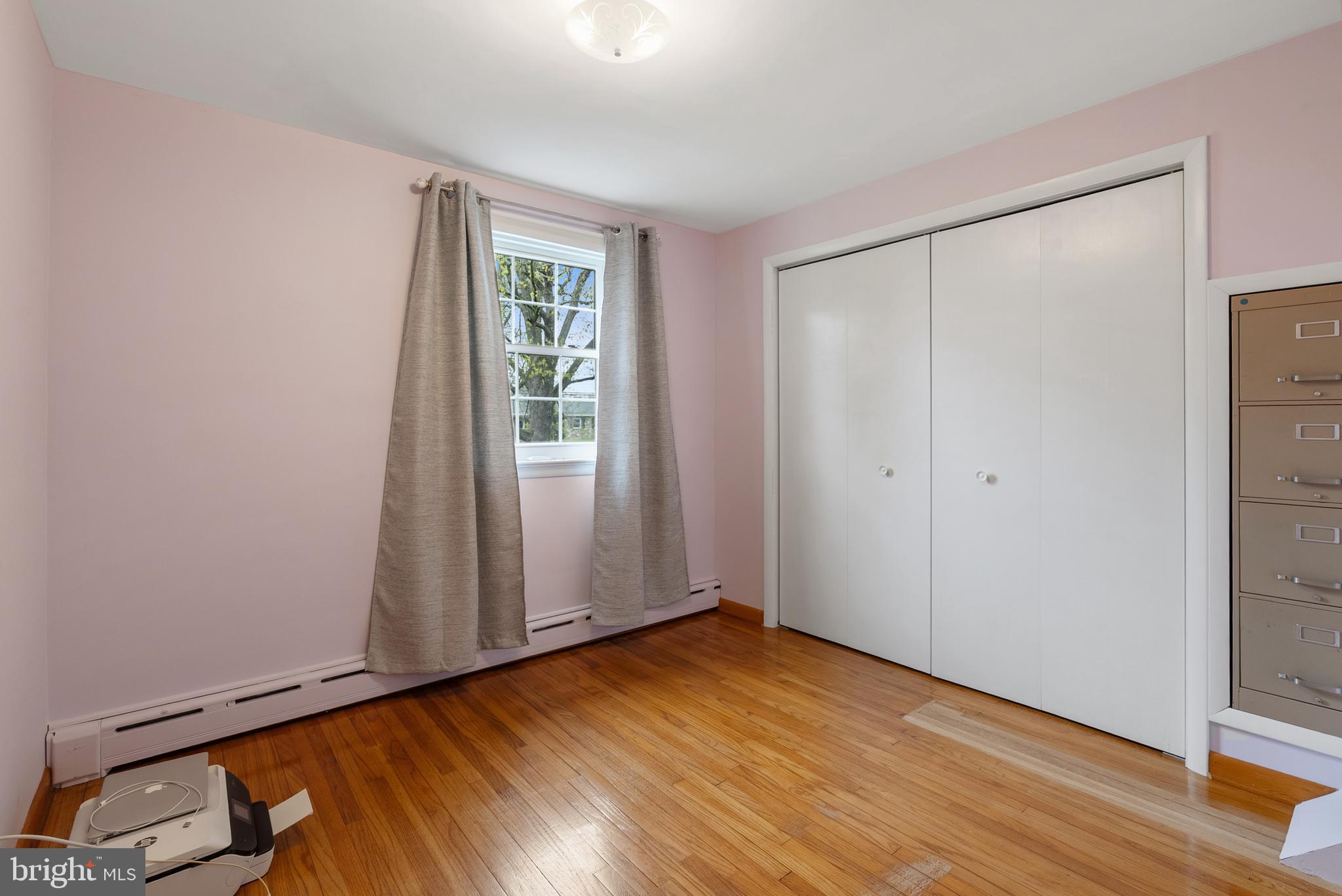 33 Derstine Road Hatfield, PA 19440 - Photo 22 of 32 an empty room with wooden floor and windows
