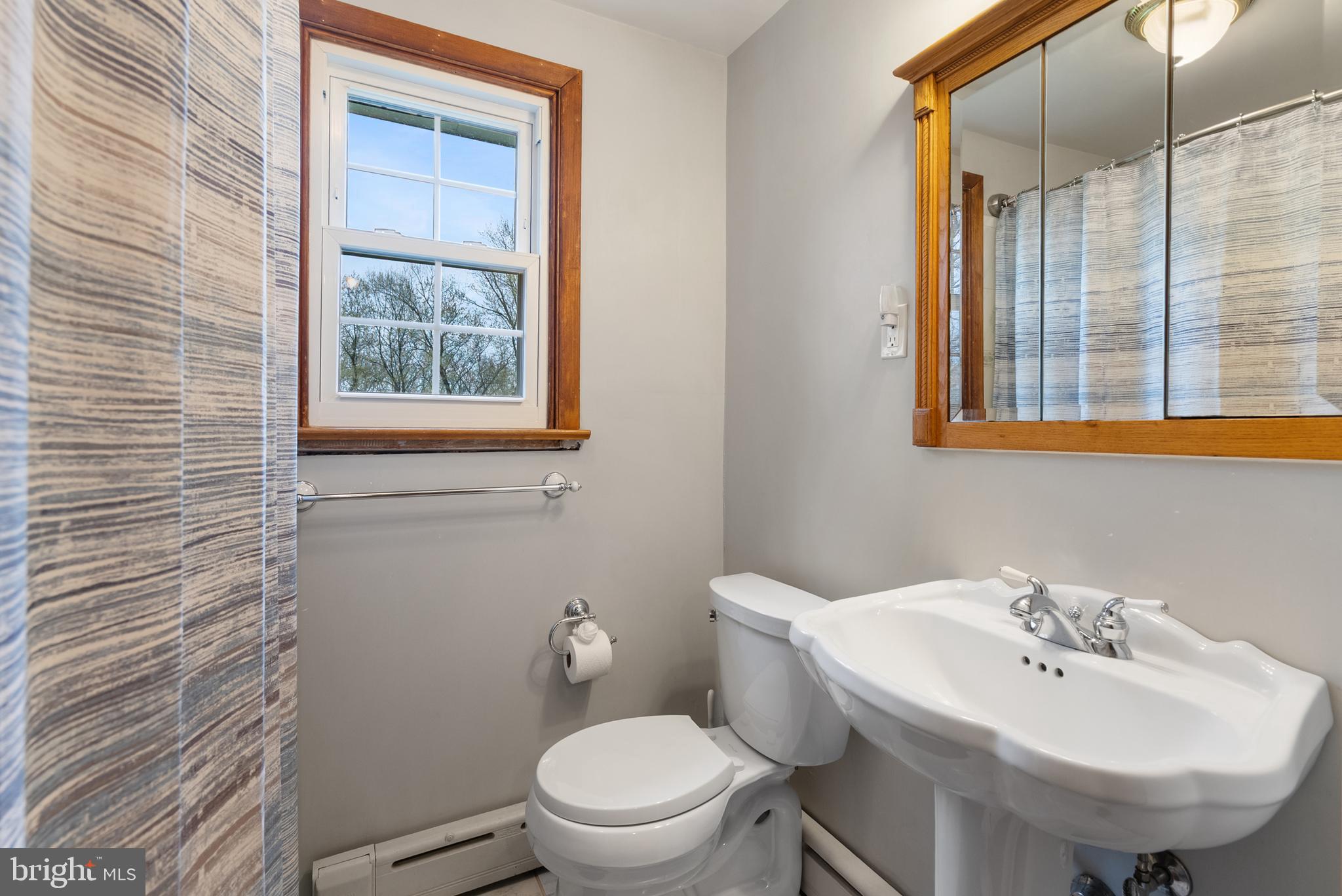 33 Derstine Road Hatfield, PA 19440 - Photo 27 of 32 a bathroom with a sink a toilet and a mirror