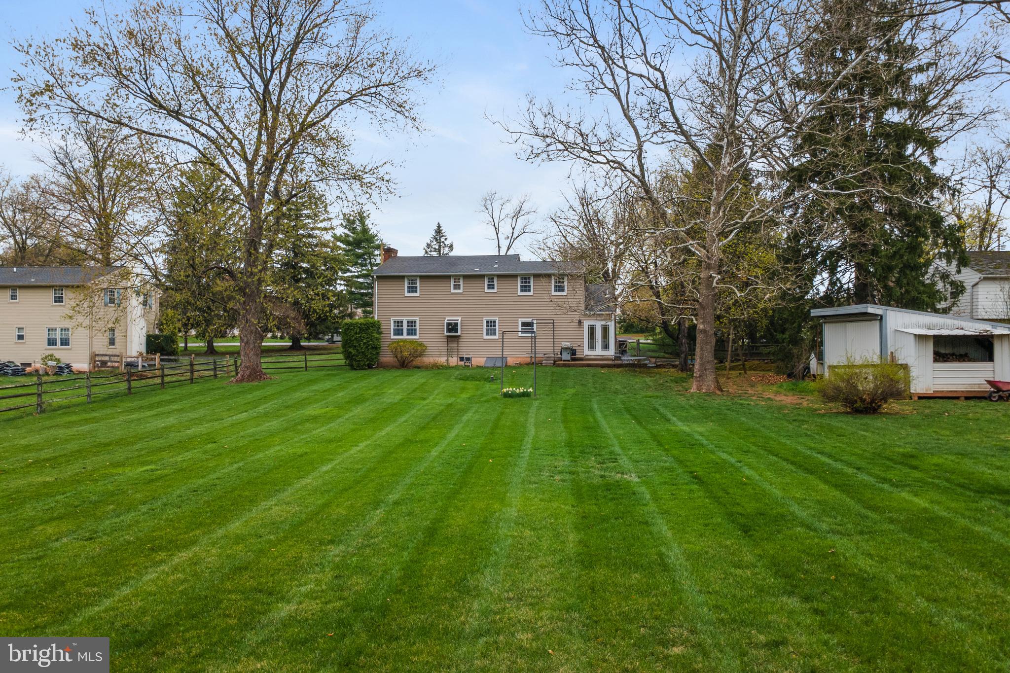 33 Derstine Road Hatfield, PA 19440 - Photo 28 of 32 a view of a white house in front of a big yard with large trees