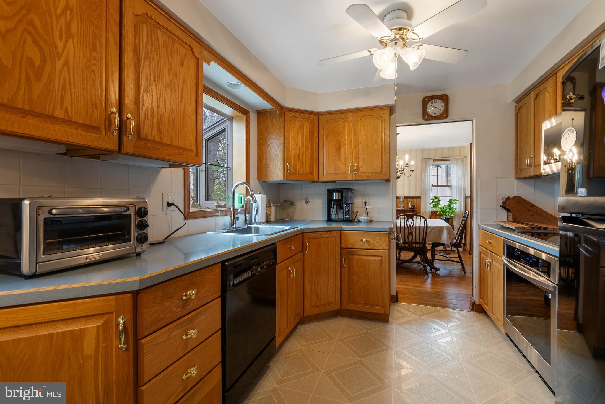 33 Derstine Road Hatfield, PA 19440 - Photo 8 of 32 a kitchen with stainless steel appliances granite countertop a stove sink and microwave