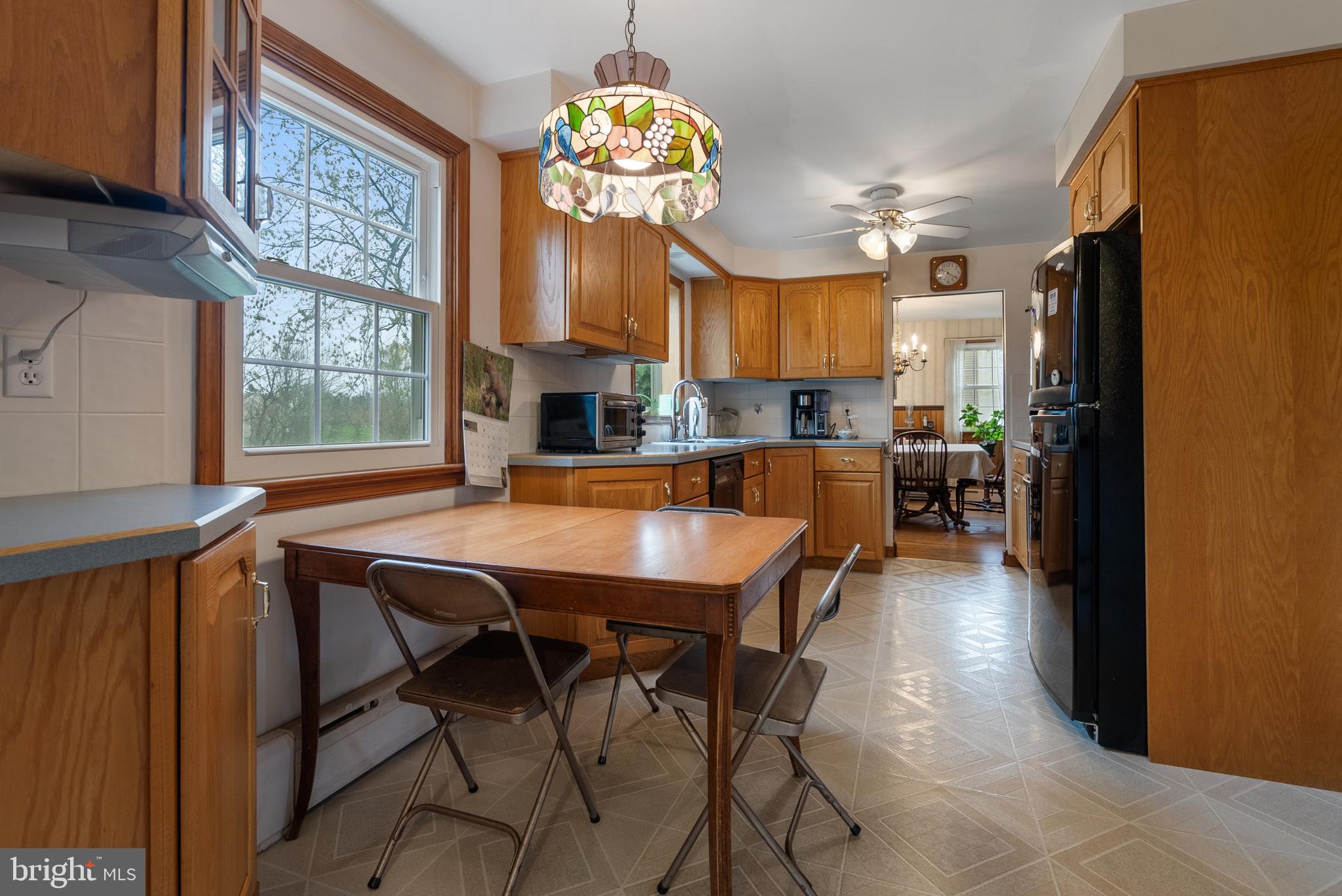 33 Derstine Road Hatfield, PA 19440 - Photo 10 of 32 a view of a dining room with furniture a chandelier and a window